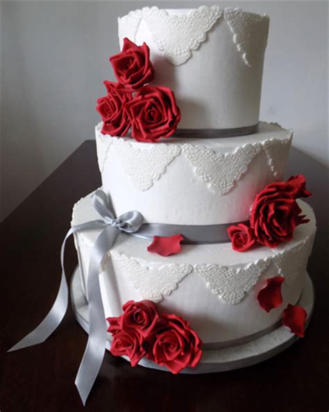 3 Tier buttercream wedding cake, decorated with silver ...