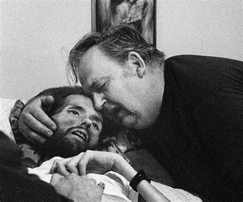A father comforts his son on his deathbed. The photo that ...