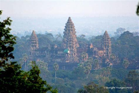 Angkor Wat in the mist view from the top of Phnom Bakheng ...