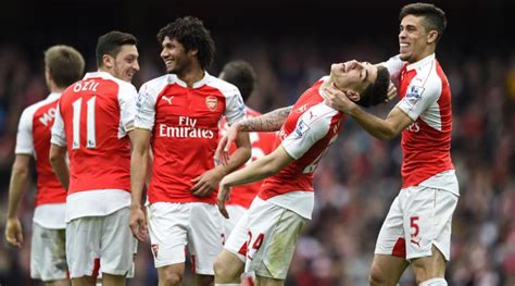 Arsenal, Manchester City keep Premier League title race ...