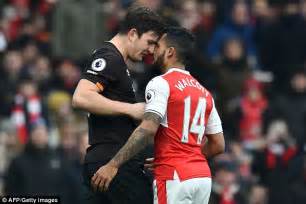 Arsenal star Theo Walcott sizes up to giant Harry Maguire ...