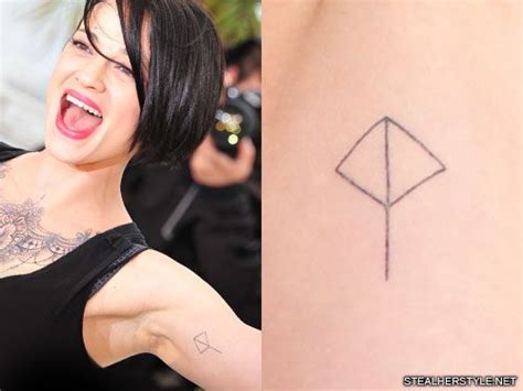 Asia Argento Logo Bicep Tattoo | Steal Her Style