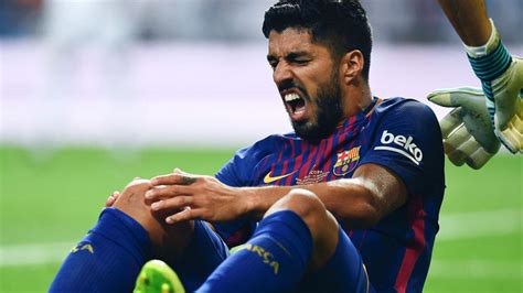 Barcelona s Luis Suarez out for a month with knee injury ...