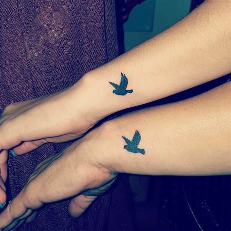 Black Silhouette Flying Birds Tattoos On Wrists