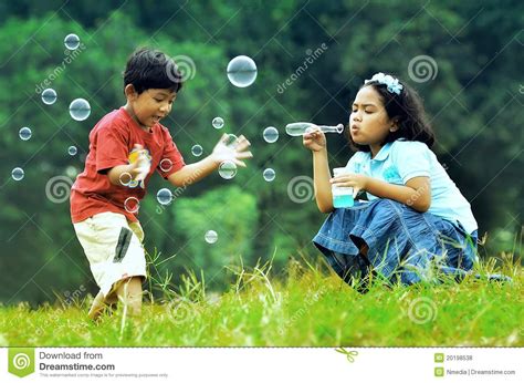 Children Playing With Soap Bubbles Royalty Free Stock ...
