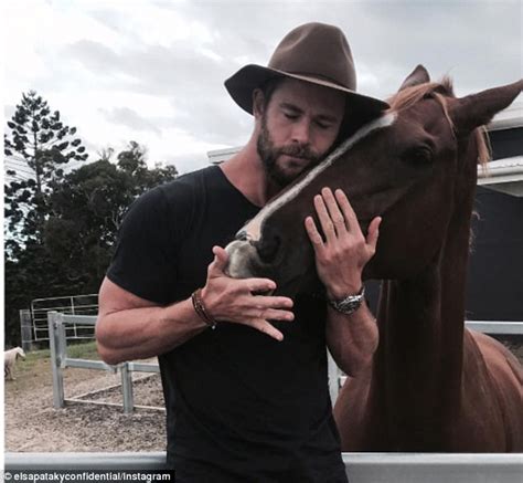 Chris Hemsworth cuddles up to a horse | Daily Mail Online
