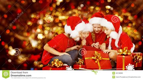 Christmas Kids Opening Present Gift Box, Children In Santa ...