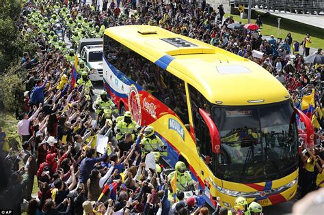Colombian football team arrives home flanked by scores of ...