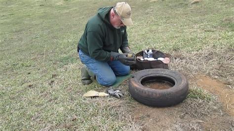David Allen resetting tire set for coyote trap   YouTube