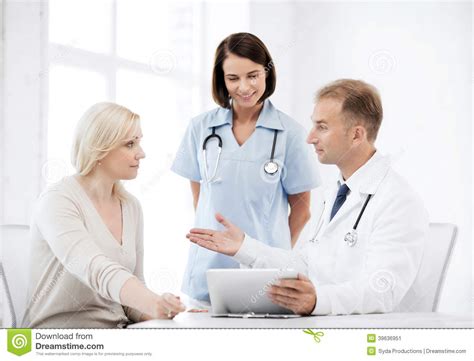 Doctor And Nurse With Patient In Hospital Stock Photo ...