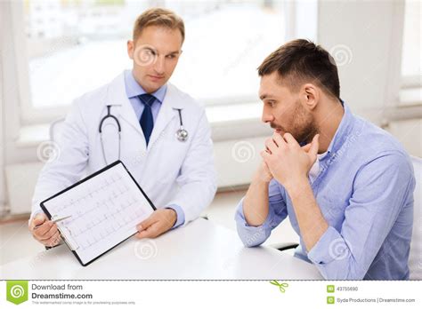 Doctor With Clipboard And Patient In Hospital Stock Photo ...