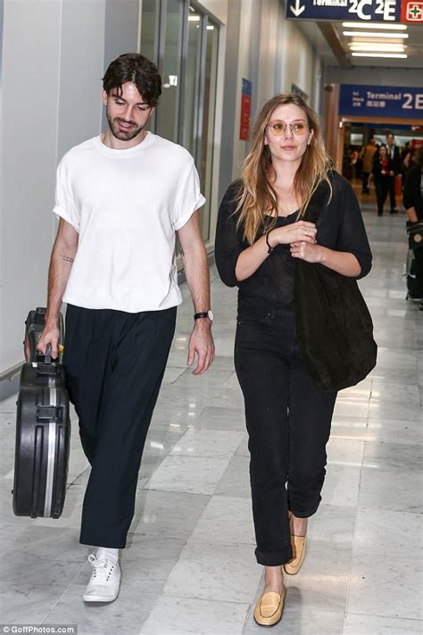 Elizabeth Olsen arrives in Paris with new musician beau ...