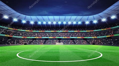 Estadio de fútbol iluminado con fans en las gradas — Foto ...