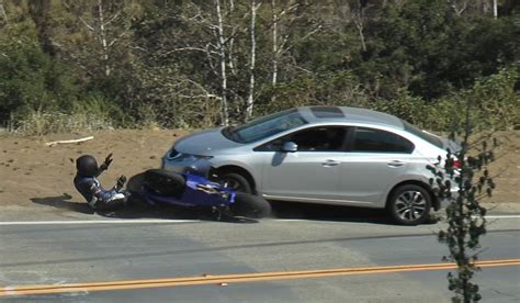 EXTREME FOOTAGE: Motorcycle Head On Collision With Car