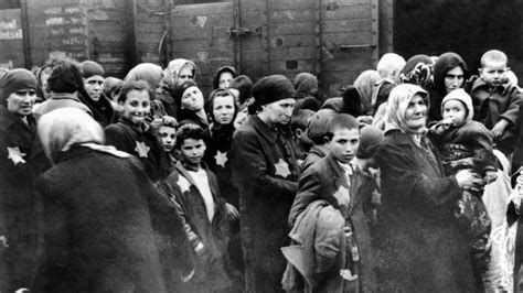 Famous photos of SS guards herding Jews to the gas ...