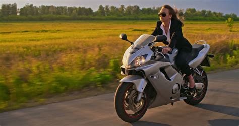 Follow Shot Of Businesswoman Riding Her Motorbike Stock ...