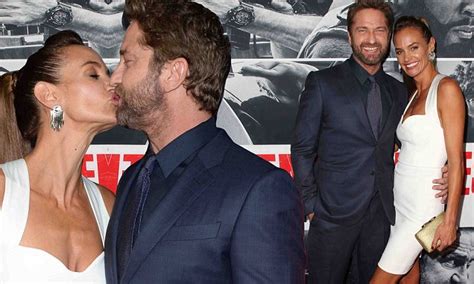 Gerard Butler and girlfriend Morgan Brown kiss at premiere ...