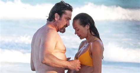 Gerard Butler and Morgan Brown Photographed on Beach ...