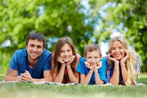 Happy family lying in a row Photo | Free Download