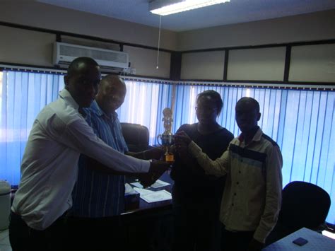 INTEGRITY CLUB EXECUTIVE HANDING OVER A TROPHY WON BY UoN ...