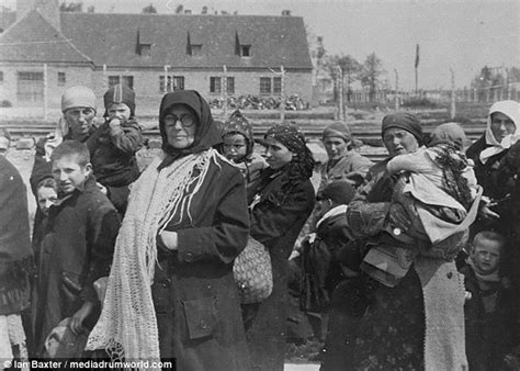 Jewish women and children queue up at Auschwitz Birkenau ...