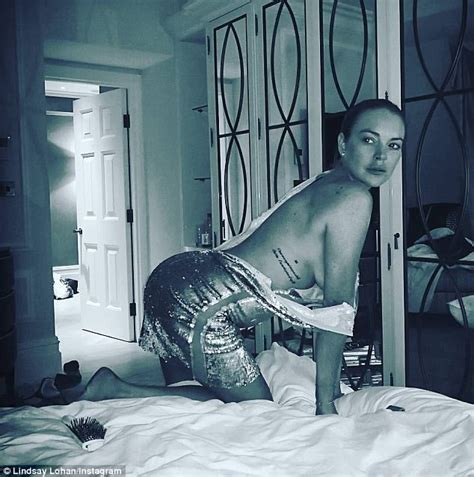 Lindsay Lohan poses atop her bed in evening Instagram snap ...