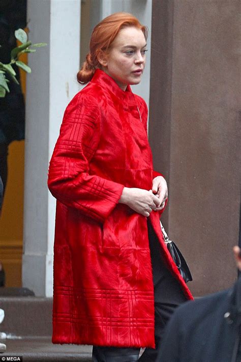 Lindsay Lohan steps out wearing a loud red jacket in NYC ...