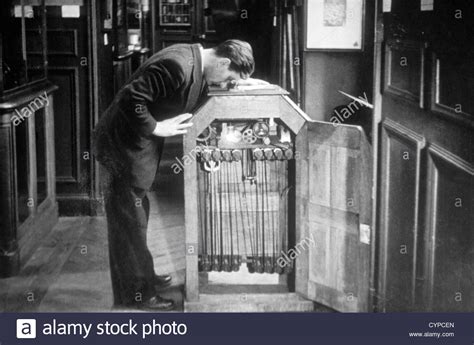 Man Looking into a Kinetoscope, Invented by Thomas A ...