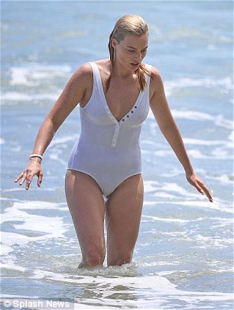 Margot Robbie manages a stylish wipe out surfing in a ...