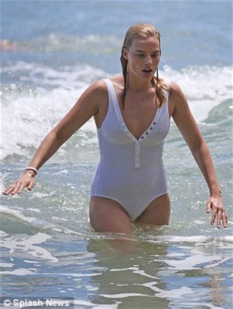 Margot Robbie manages a stylish wipe out surfing in a ...