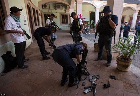 Mexican vigilante gunmen disarm local POLICE so they can ...