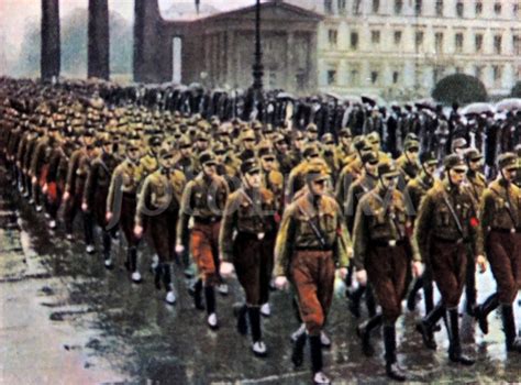 Nazi SA brownshirts march through the Brandenburg Gate in ...