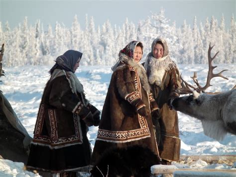 Nomadic Nenets women at their encampment in the tundra ...