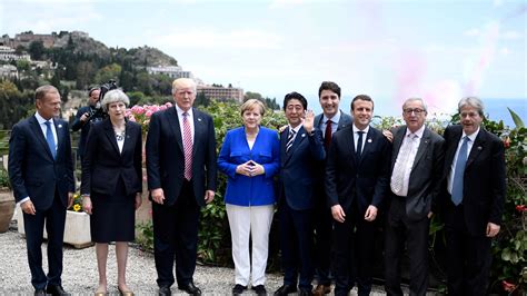 Out of step: G7 leaders take a stroll, Trump takes a golf ...