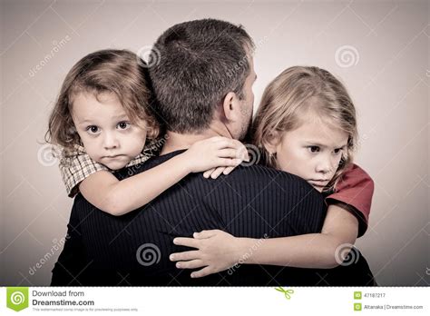 Portrait Of One Sad Children Hugging Her Father Stock ...