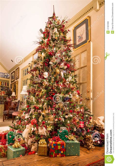 Presents Under Decorated Christmas Tree In Den Stock Photo ...