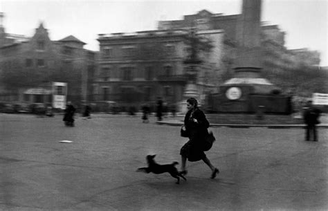 Robert Capa SPAIN. Barcelona. January 1939. Running for ...