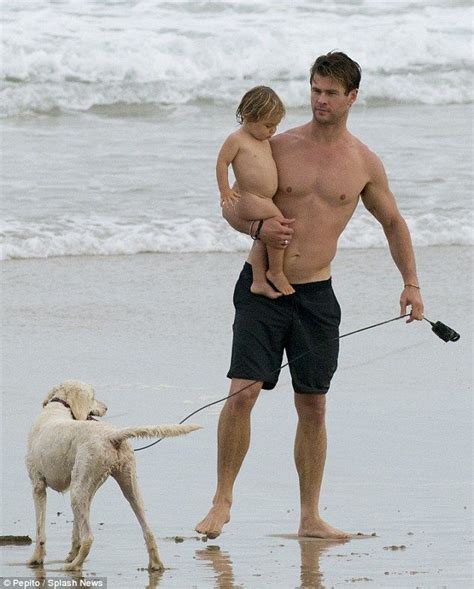 Shirtless Chris Hemsworth parades toned frame on the beach ...