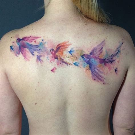 Silhouette Flying Birds Tattoo On Upper Back