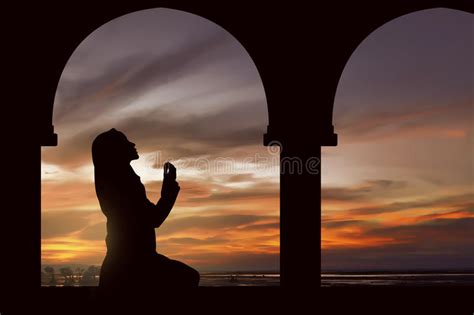 Silhouette Of A Women Praying During Sunset Stock Image ...