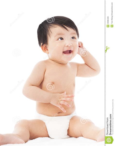 Smiling Infant Child Baby Sitting And Look Up Stock Photo ...