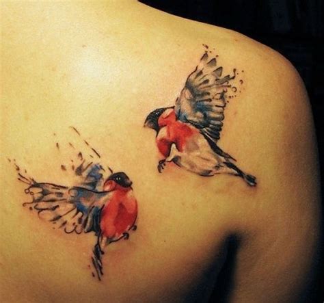 Two flying birds tattoo
