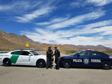US Border Patrol and Mexican Federal Police greet each ...