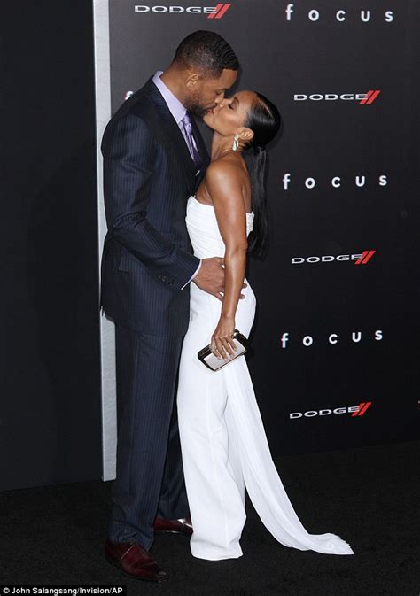Will Smith kisses wife Jada at Focus premiere after ...