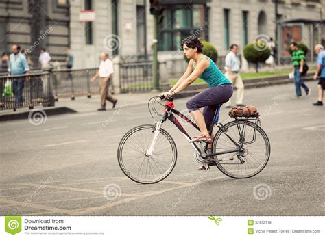 Woman Riding A Bike In Alcala Street, Madrid Editorial ...